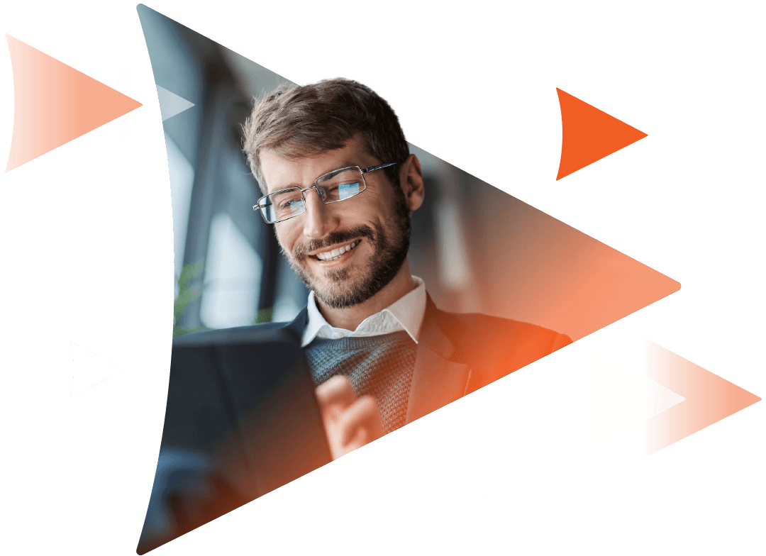 Simplify your training management with a Learning Management System (LMS) A happy man, smiling while viewing his tablet